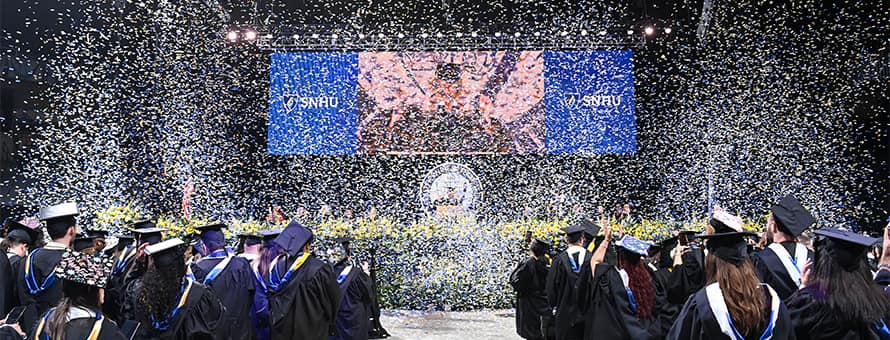 Confetti falling over graduates at the SNHU 2025 Spring Commencement 