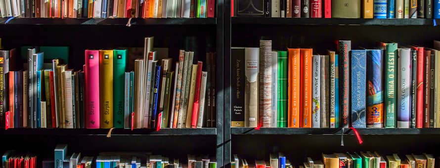 A black bookshelf full of books