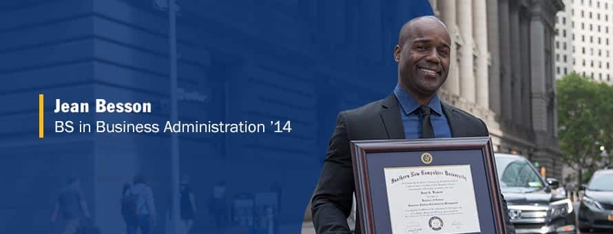SNHU graduate Jean Besson holding his framed diploma and the text Jean Besson BS in business administration '14.