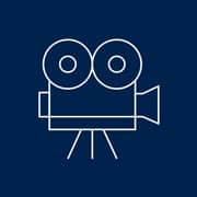A blue and white icon of a movie camera