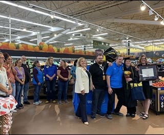 Carol D'Anna surrounded by her support system after receiving her diploma 