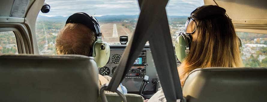 Two people flying an airplane