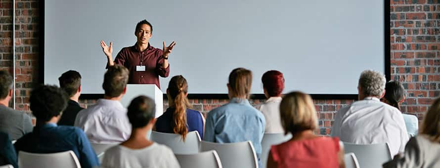 A communication major presenting to his class about what you can do with a communications degree