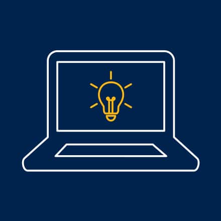 An icon of a laptop with a yellow lightbulb on its screen