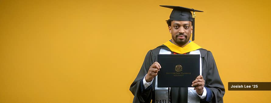2025 online cybersecurity program graduate Josiah Lee holding his SNHU diploma.