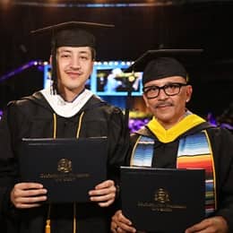 Angel Perez, left, a human services graduate, with father David Perez, right, a business administration graduate.