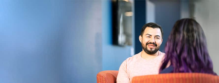 A man and woman engaged in a conversation