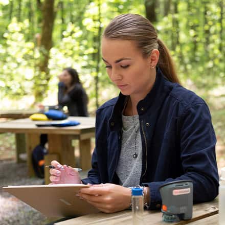 Students working in the field on environmental sustainability practices