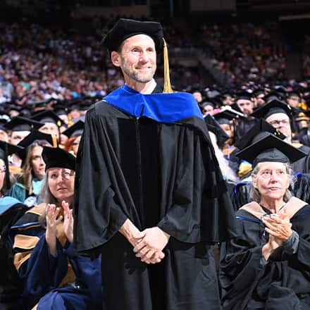 Dr. Jackson T. Zimmerman, a 2025 Distinguished Online Teaching Award recipient being recognized at SNHU's 2025 Spring Commencement.