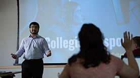 A student asking a question in a classroom