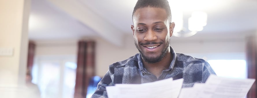 A man reads a financial award letter