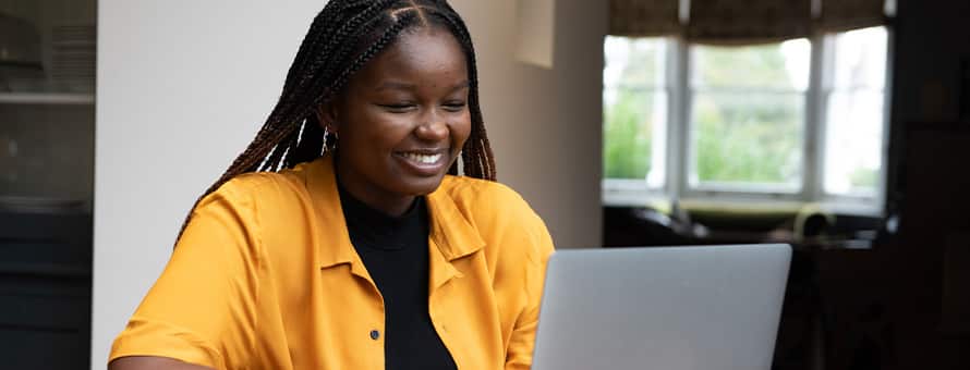 A future online student completing her education on a laptop.