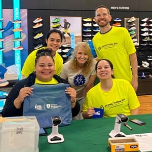 Five Global Days of Service volunteers at the Charlotte RaceFest Packup Pickup.