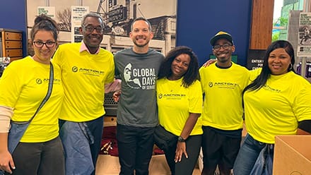 Six volunteers supporting the RaceFest Packet Pickup project in North Carolina for SNHU’s Global Days of Service.