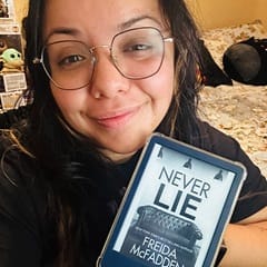 Graciela Gutierrez, an academic advisor at SNHU, holding a book