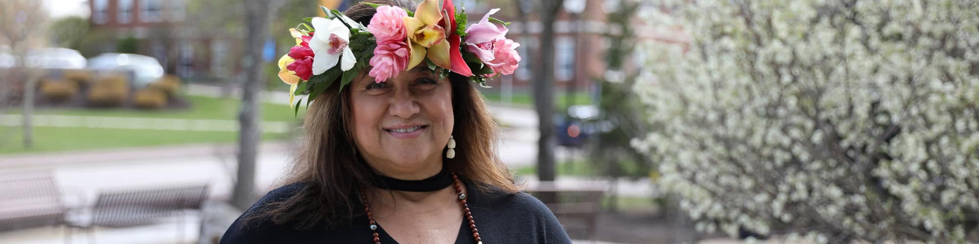Sharla Kaleihua Kahale-Miner ’23, a Hawaii resident and SNHU graduate, smiling and wearing a floral crown.