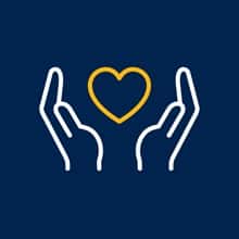 An icon of two hands holding a heart