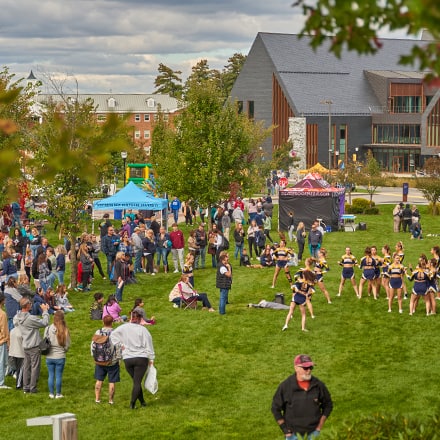 People gathered on Southern New Hampshire University's green space during the 2023 Homecoming Street Fair