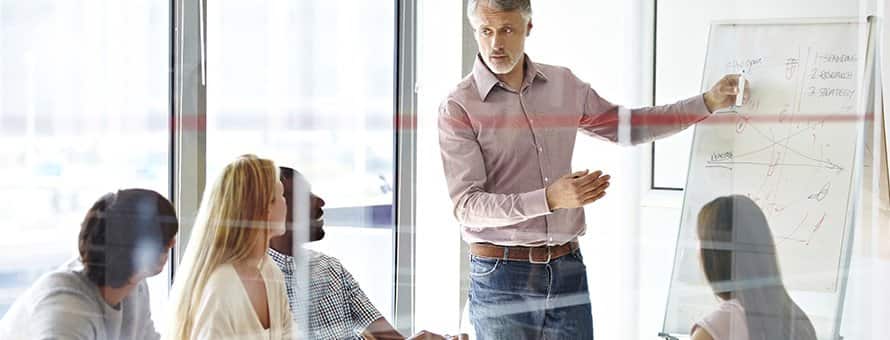 Manager running a team meeting