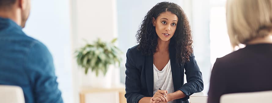 A professional who became a mental health counselor, speaking with a client.