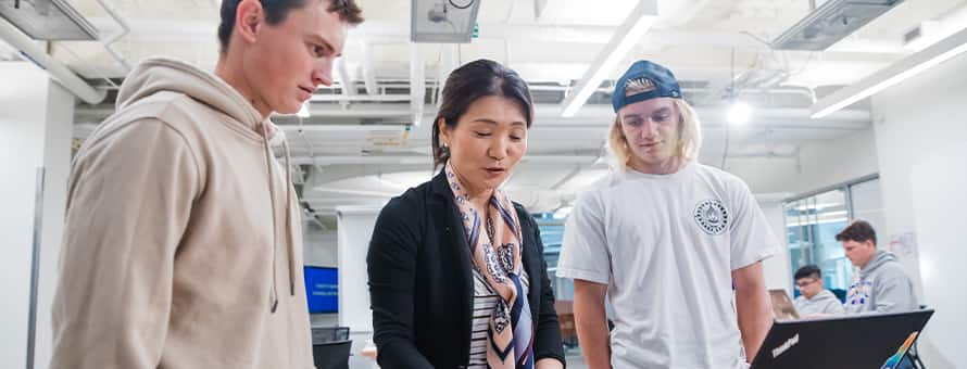 An instructor showing students how to become a teacher