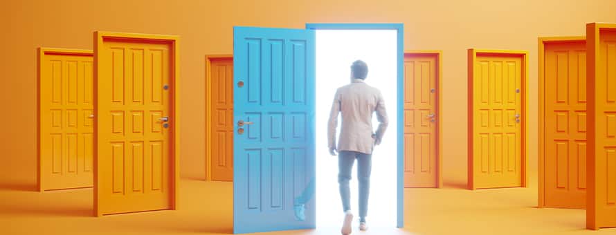 A person walking into an open blue door in a room full of orange doors.
