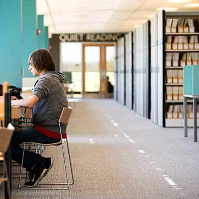 Student studying in a library