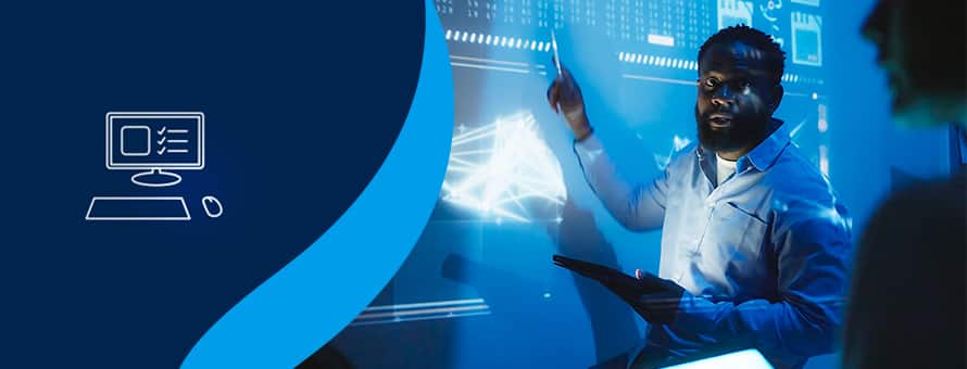 An icon of a desktop computer alongside a tech professional presenting data projected in blue.