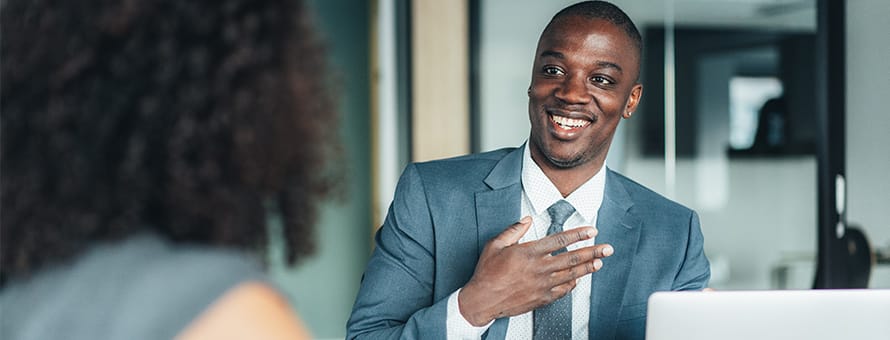 HR professionals discussing the benefits of earning a HR degree