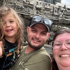 Katie Waddy Battisti, right, with her husband, center, and their daughter, right.