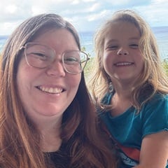 Katie Waddy Battisti, left, holding her daughter, right.