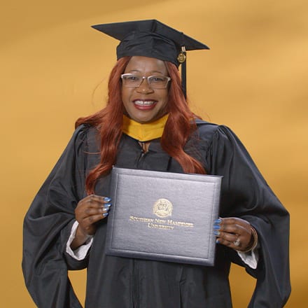 Lilian Ongaki, a 2024 SNHU graduate who earned her master's degree in healthcare administration.