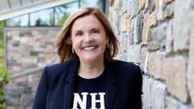 SNHU President Lisa Marsh Ryerson standing outside and smiling.