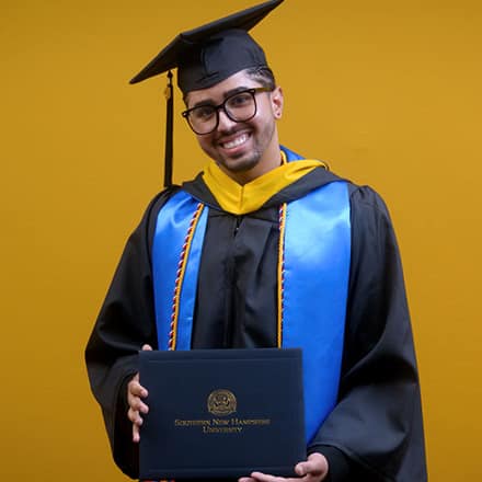 Luis Zayas, a 2025 graduate from SNHU with a bachelor's in healthcare administration.