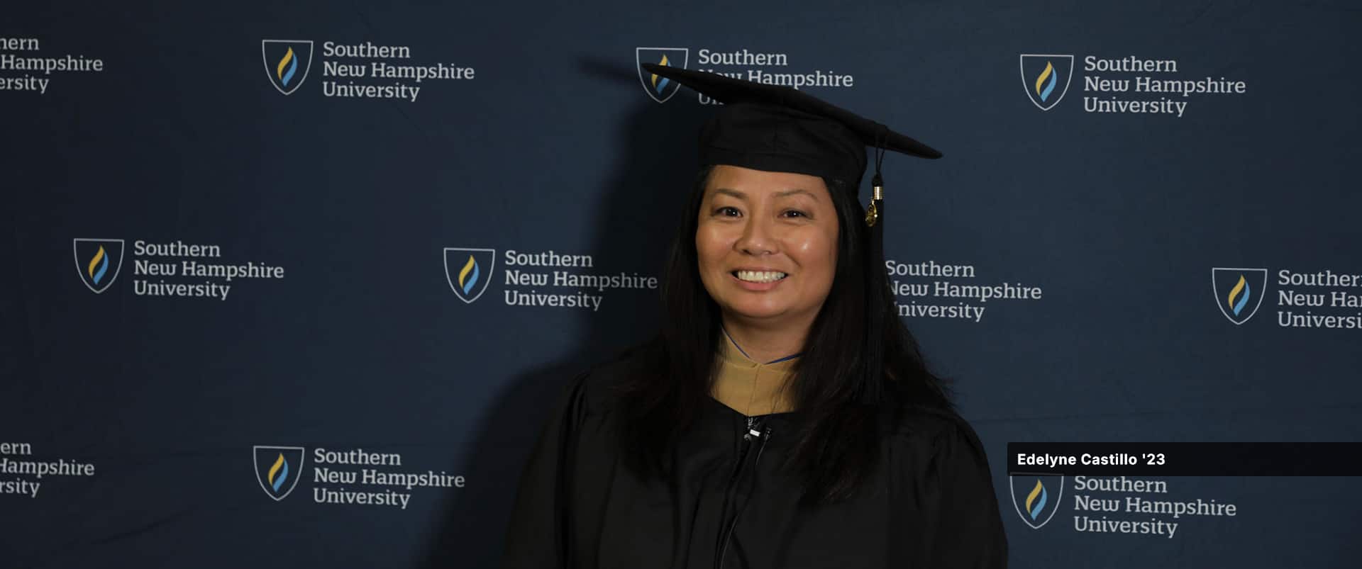 Edelyne Castillo, who earned her MBA in business analytics from SNHU in 2023, wearing her cap and gown.