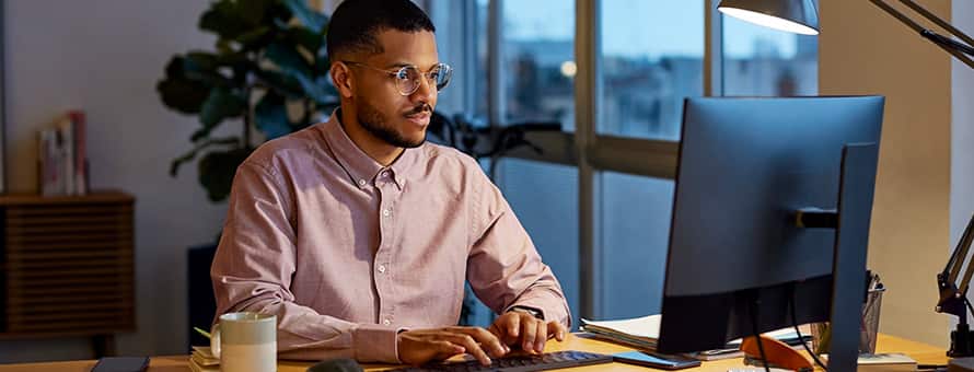 A business professional researching the best MBA programs.