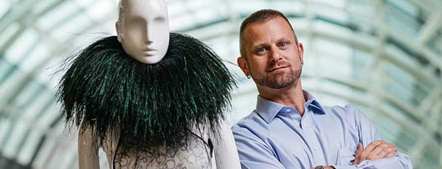 Ben Van Beusekom with an art piece he designed for a Disney theme park attraction.