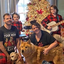 The Maile family and their two dogs from left to right: Cody, Kane, Codie and Kaleigh.