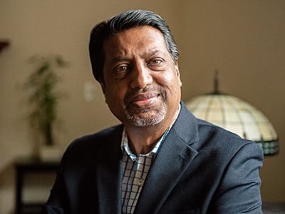 Dr. Ranjit Nair, an adjunct faculty member in SNHU's online MBA in Human Resources program, wearing a sports coat and button down shirt.