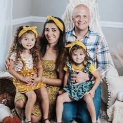 Rochele Grierson, center, with her husband and their two daughters.