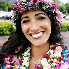 Rochele Grierson, a military spouse scholarship recipient, with a flower crown and necklace.
