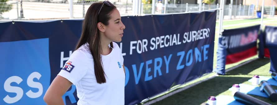 A professional in a sports management career at an event.