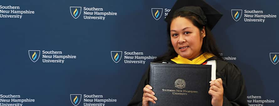 2024 Graduate Stella Bory holding certificate