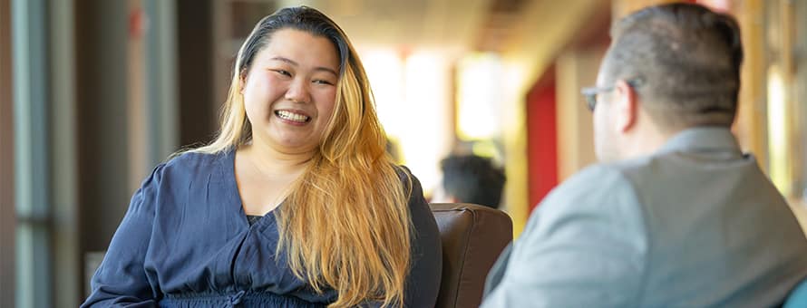 A student speaking with a member of a career services team for career support