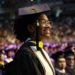 Tanner McCarthy smiling during her SNHU commencement ceremony.
