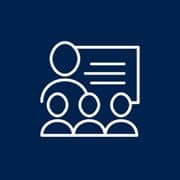 An icon of a teacher presenting a lesson to three students.