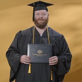 Travis Baril, a 2024 SNHU graduate who earned his bachelors degree in psychology. 