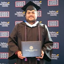 Juvenal Rivera III with his diploma 