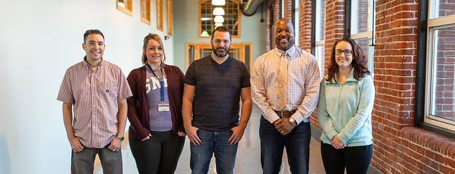 SNHU career and academic advisors Alex Chapa, Mallory Grenier, Ryan Ladd, Leonard Bell and Colleen Kuplast.