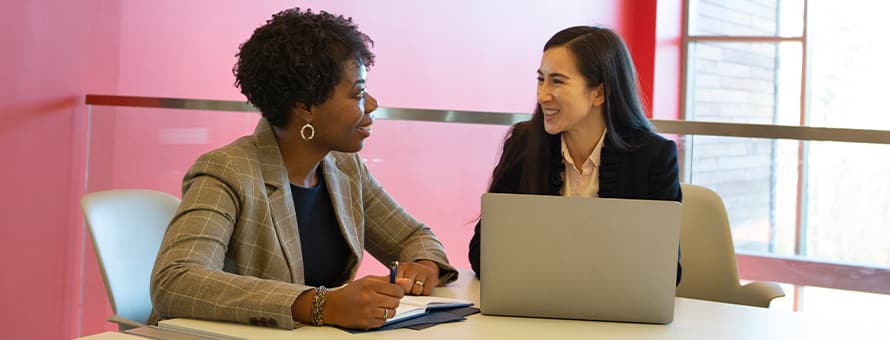 Two professionals discussing what soft skills are and why they are important in the workplace